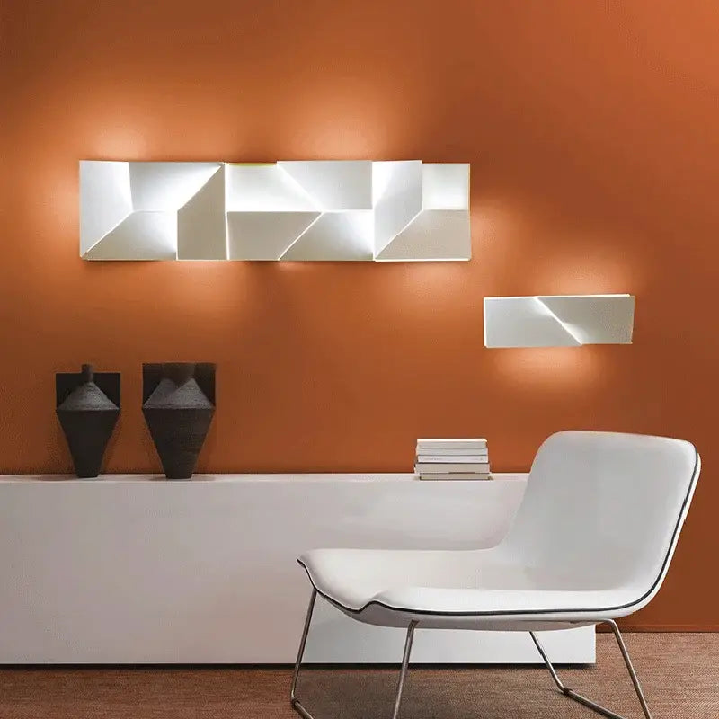 Modern geometric white grand sconce lamp with angular facets and minimalist design for bedroom decorbites grand sconce