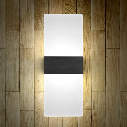 Modern geometric wood and acrylic wall sconce lamp with white diffuser and black accent strip for bedroom wall lighting