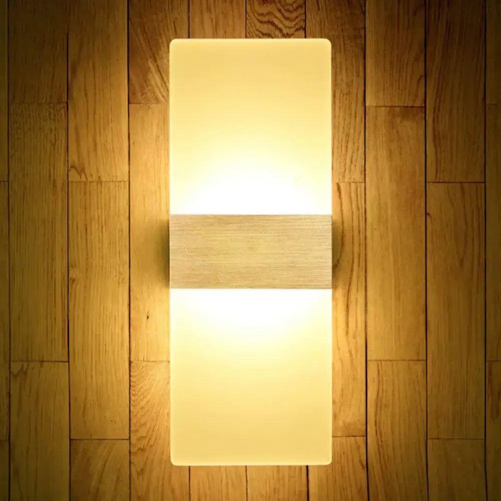 Modern geometric wood and acrylic wall sconce lamp with warm glowing diffuser and horizontal wooden accent wall lamp