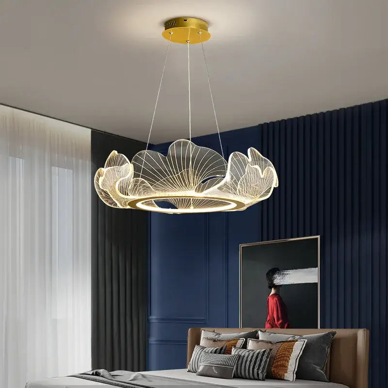 Modern ginkgo gold acrylic pendant light with gold-toned leaf design for elegant dining room decorbites chandelier