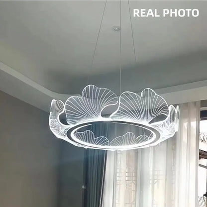 Modern ginkgo gold acrylic pendant light featuring a circular LED chandelier with white light and ginkgo leaf decorbites design