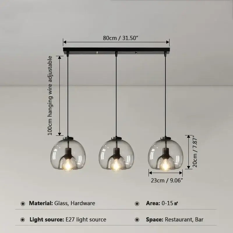 Modern three-light pendant lights with clear glass ball led shades and black metal hardware for dining room decorbites