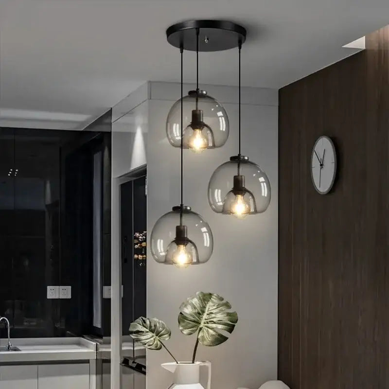 Modern glass ball led pendant lights with warm bulbs hang from black circular fixture for dining room decorbites pendant lights