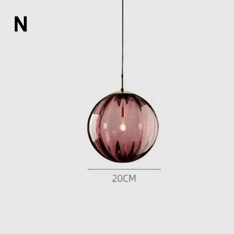 Modern glass ball lustre pendant lights featuring a spherical translucent amethyst glass ball with gold fixture and black cord