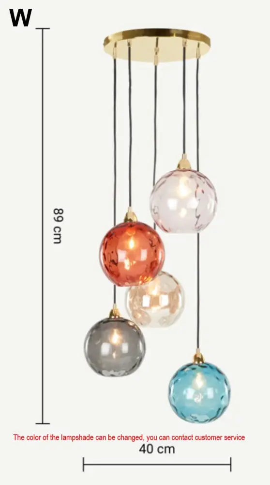 A modern hanging pendant lights fixture with five colorful textured glass ball lustre globes on gold mount