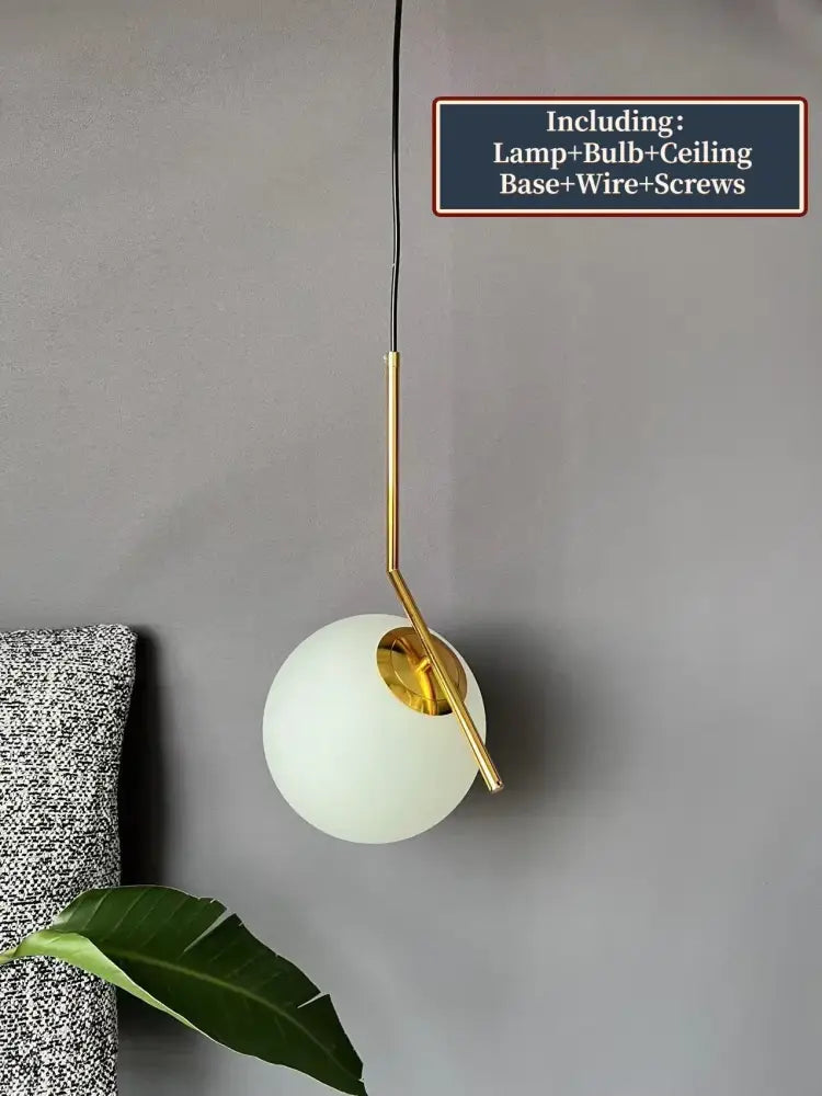 Modern glass ball pendant light with frosted white glass shade and polished gold metal accents for dining room decorbites pendant light