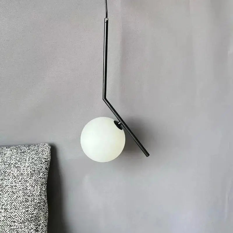 Minimalist black metal pendant light with frosted white glass ball globe for modern decorbites glass ball pendant lighting
