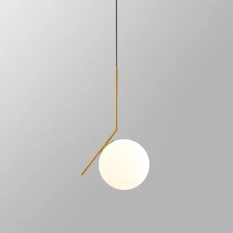Modern glass ball pendant light with sleek gold-toned metal frame and opaque white glass shade for dining room decorbites glass ball pendant