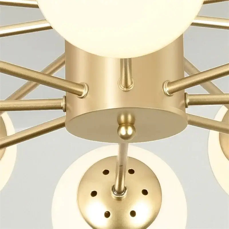 Modern gold-toned glass ball pendant lights with frosted globe shades and geometric design for living room decorbites chandelier