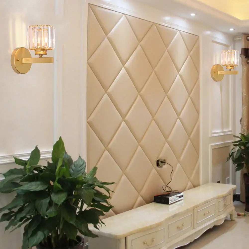Beige quilted leather accent wall panel with diamond tufting complements modern glass ball wall lamp decorbites crystal sconce