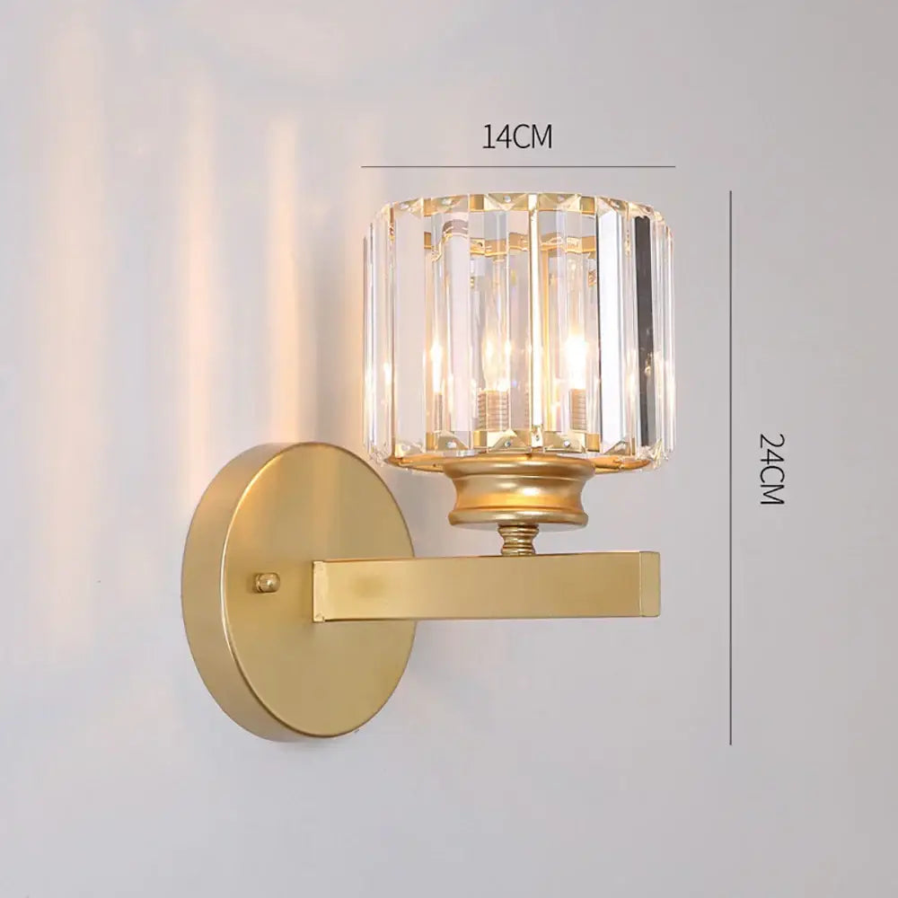 Gold-toned modern glass ball wall lamp with cylindrical crystal shade and vertical faceted glass panels by decorbites