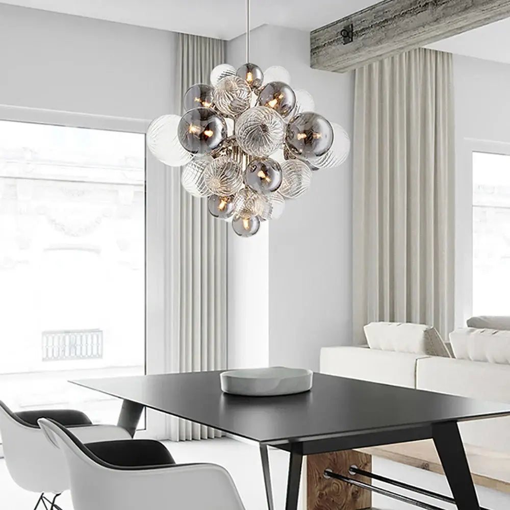 Modern glass bubble ceiling chandelier with textured silver and frosted glass spheres suspended by a thin chain decorbites glass bubble