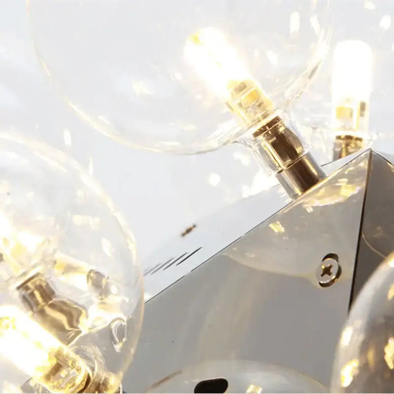 Modern chrome finished wall sconce with clear glass globe bulbs from decorbites glass bubble led hanging lamp series