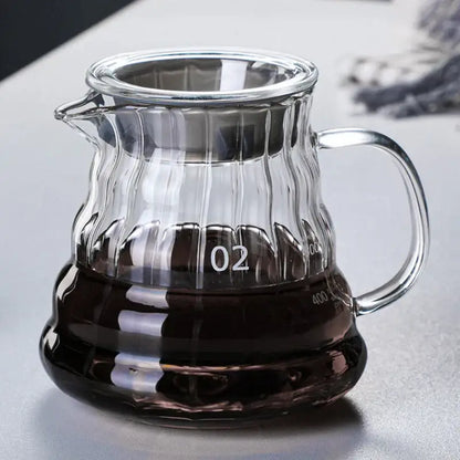 Clear glass coffee carafe with ribbed texture and silver-toned metal lid and handle from decorbites glass coffee line