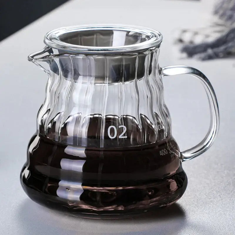 Clear glass coffee carafe with ribbed texture and silver-toned metal lid and handle from decorbites glass coffee line