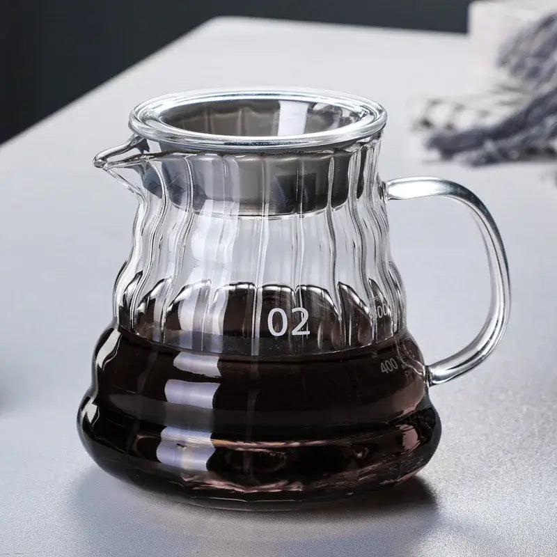 Modern glass coffee carafe with ribbed clear glass body and silver-toned metal lid and handle decorbites glass coffee
