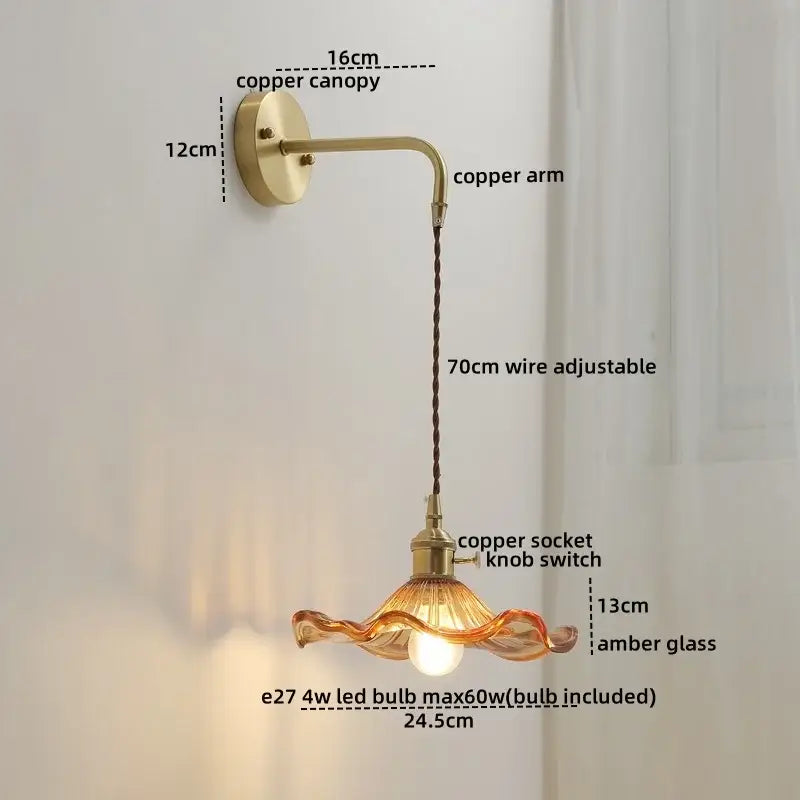 A vintage-style glass copper led wall sconce with amber wavy glass shade and integrated led bulb for bedroom wall lights