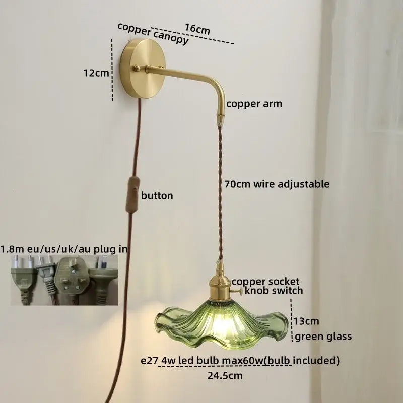 A vintage-style wall light with a brass-finished copper arm and adjustable wire suspending a green glass copper led shade