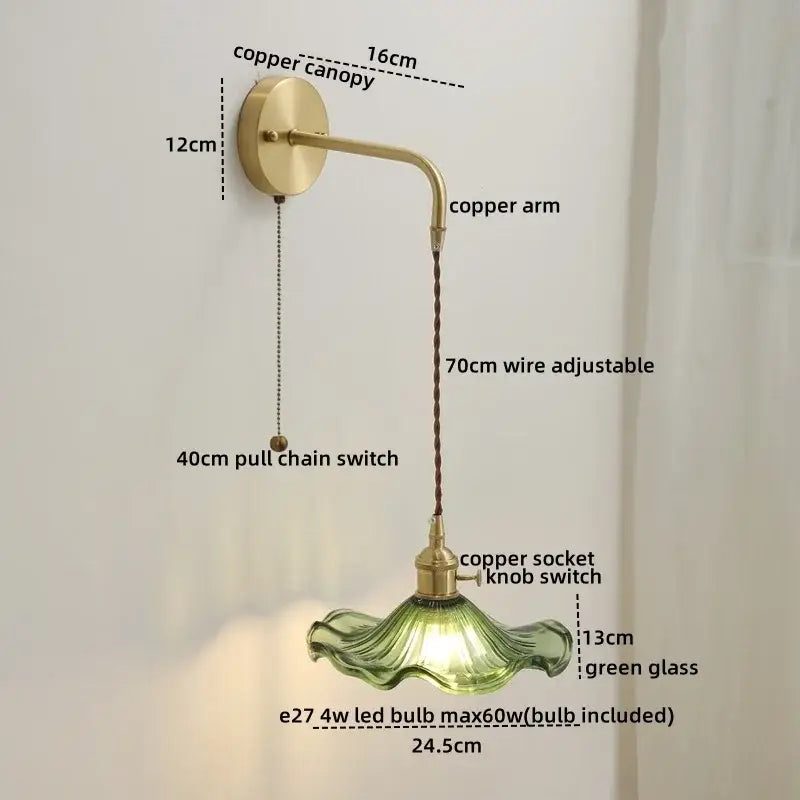 A vintage-style wall light with a brass copper led arm and adjustable wire featuring a green glass copper led shade