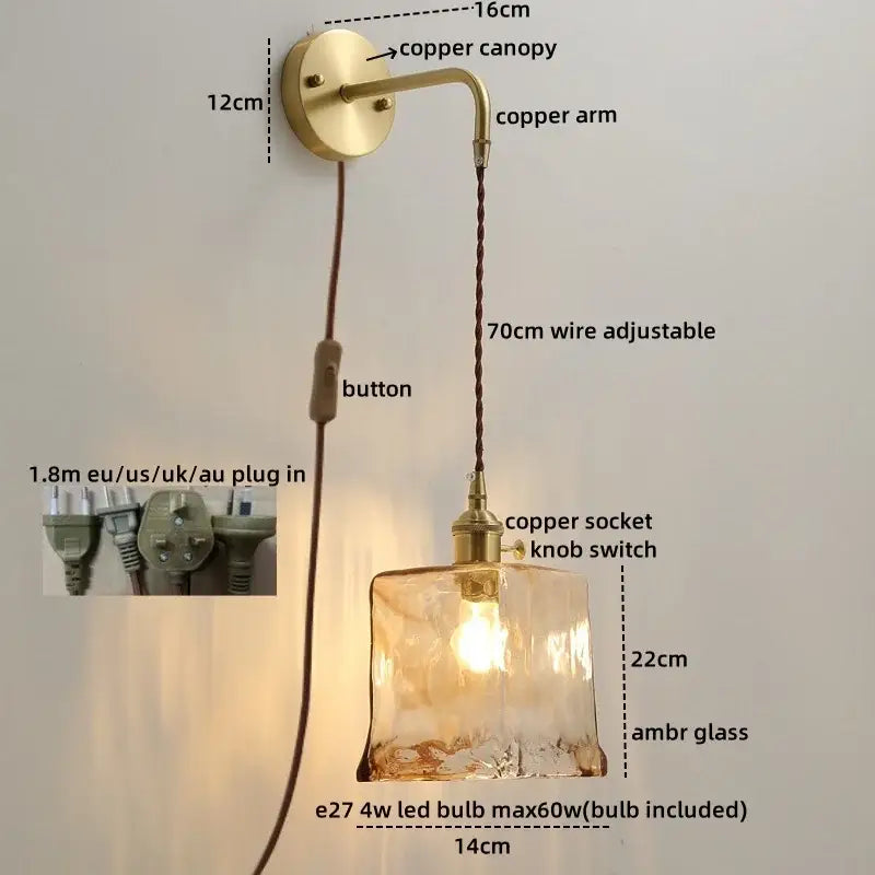 A warm amber glass copper led wall light with copper canopy and adjustable 70cm wire for bedroom use