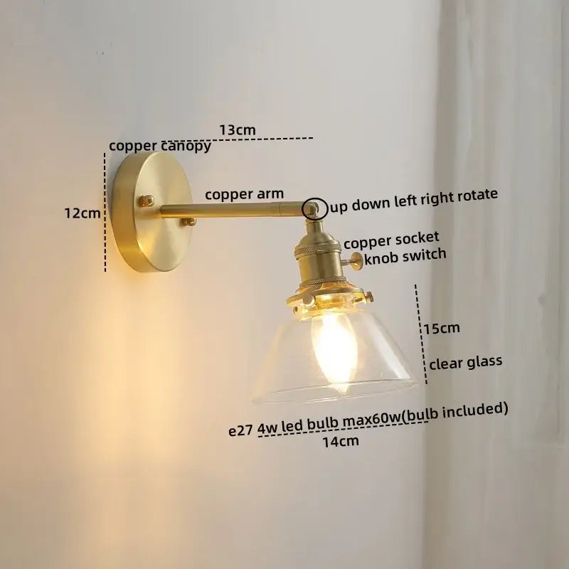 Brass-finished copper led wall light with clear glass shade and adjustable arm for modern bedroom reading