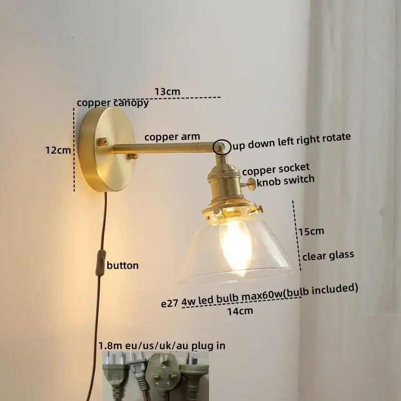 Brass-finished copper led wall light with clear glass shade and adjustable arm for modern bedroom reading use