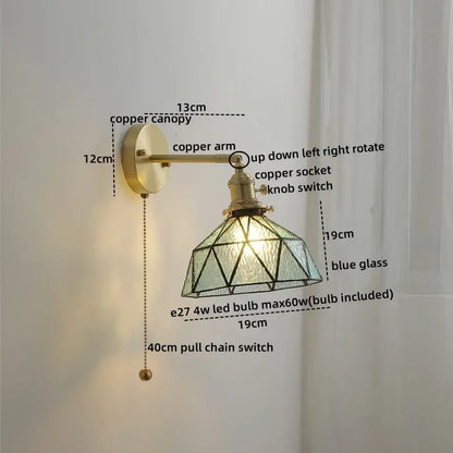 Vintage-style wall lights with brass-finished copper led arm and geometric blue glass copper led shade for bedroom reading