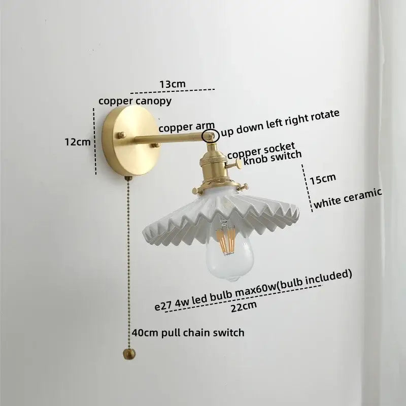 Vintage-style wall lights with brass-finished copper led arm and white ceramic scalloped shade for bedroom reading