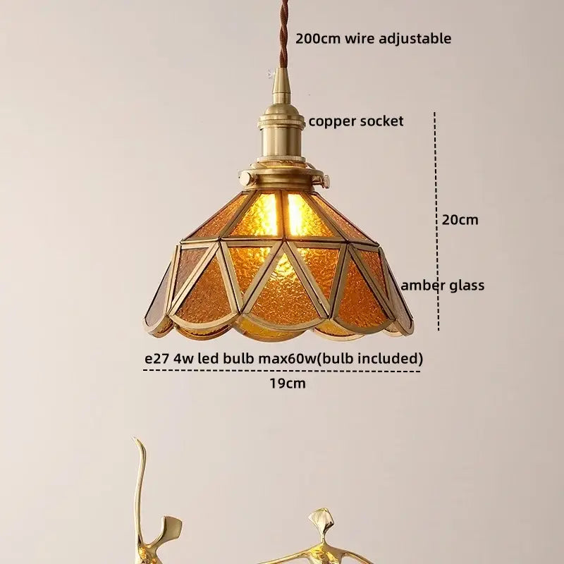 Modern glass copper pendant light with brass-finished copper socket and amber glass panels for dining room island