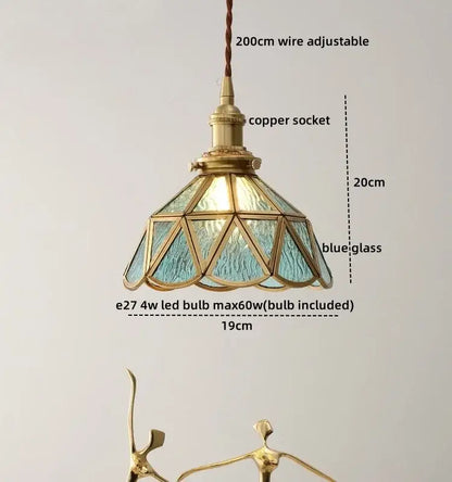 Modern glass copper pendant light with blue textured glass panels and brass copper socket for dining room island