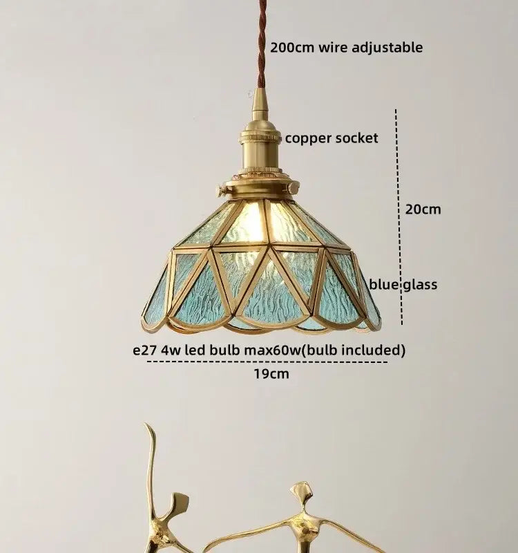 Modern glass copper pendant light with blue textured glass panels and brass copper socket for dining room island