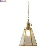 Brass-framed glass copper pendant light with clear panels and twisted brown cord for dining room or kitchen island