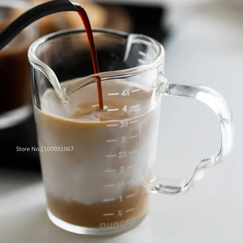 Modern glass cup milk latte jug with clear measuring lines and wooden handle for precise kitchen use