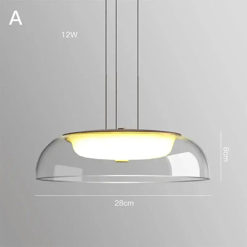 Modern glass pendant light with clear glass dome, warm yellow 12w bulb, and black cords for dining room wood fixture