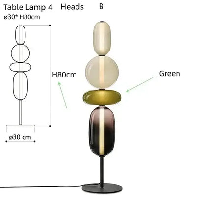 Elegant modern glass floor lamp with stacked oval orbs in cream olive green and dark amber on black metal base with led light