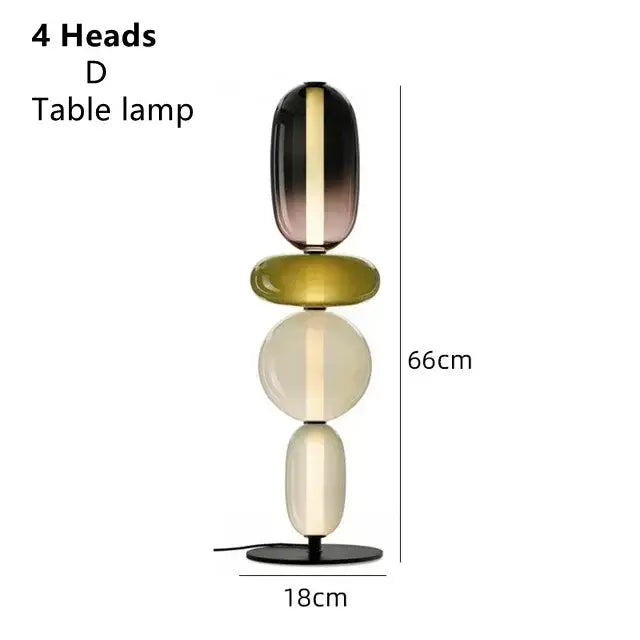 Modern glass floor lamp led with four stacked oval glass heads in black olive green and cream for living room use
