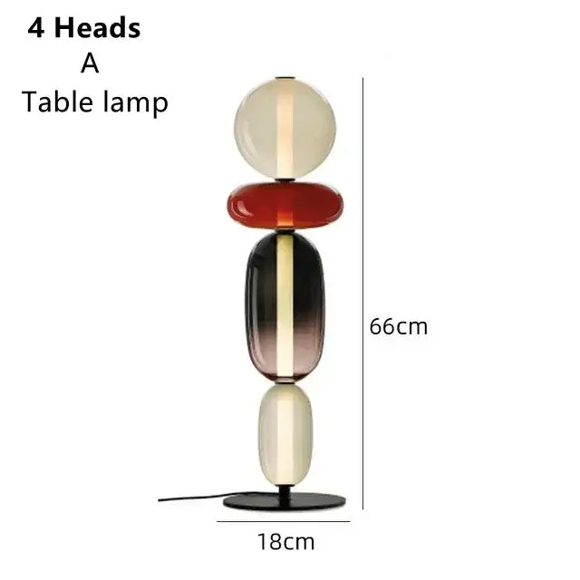 A modern glass floor lamp led set of 3 with cream red and gradient black cream stacked orbs for living room use