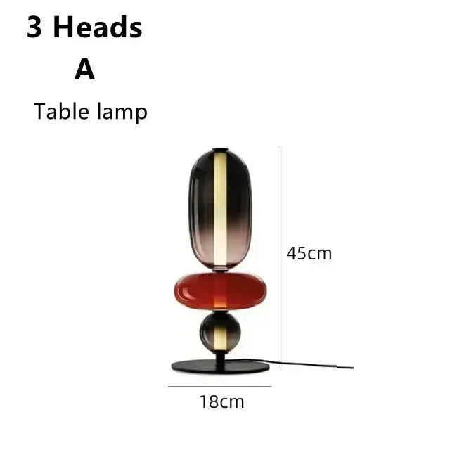 Modern glass floor lamp set of 3 with three stacked glass orbs in black amber red and silver on a black led base