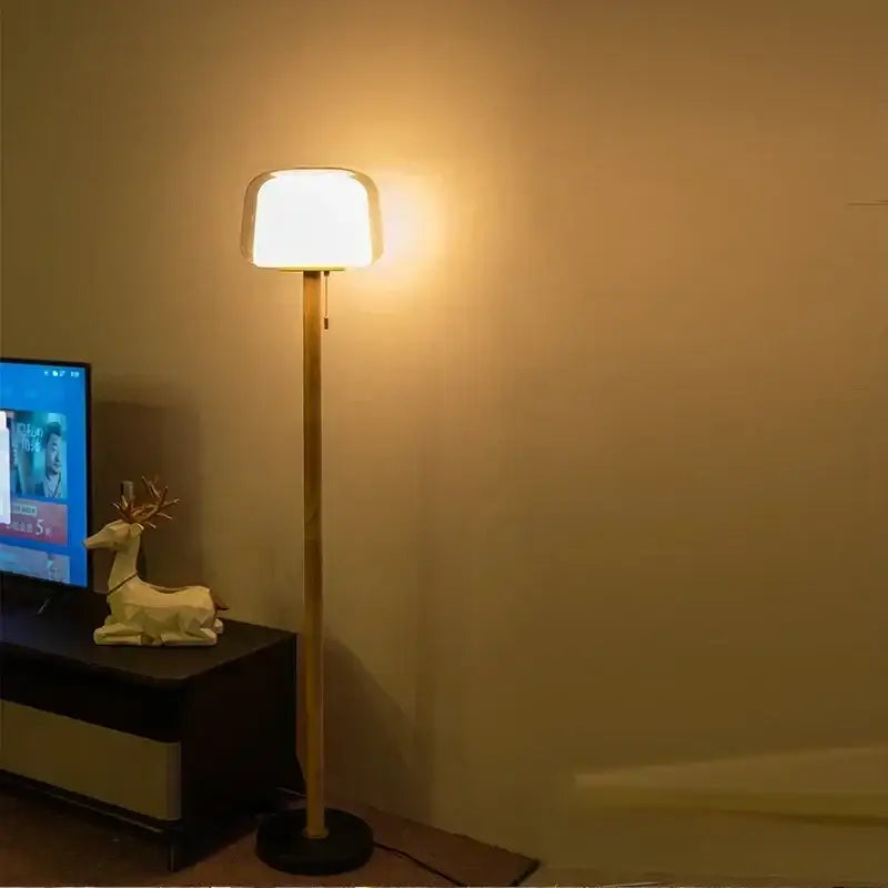 Modern glass floor lamp with sleek bamboo pole and soft white rectangular shade for warm living room lighting