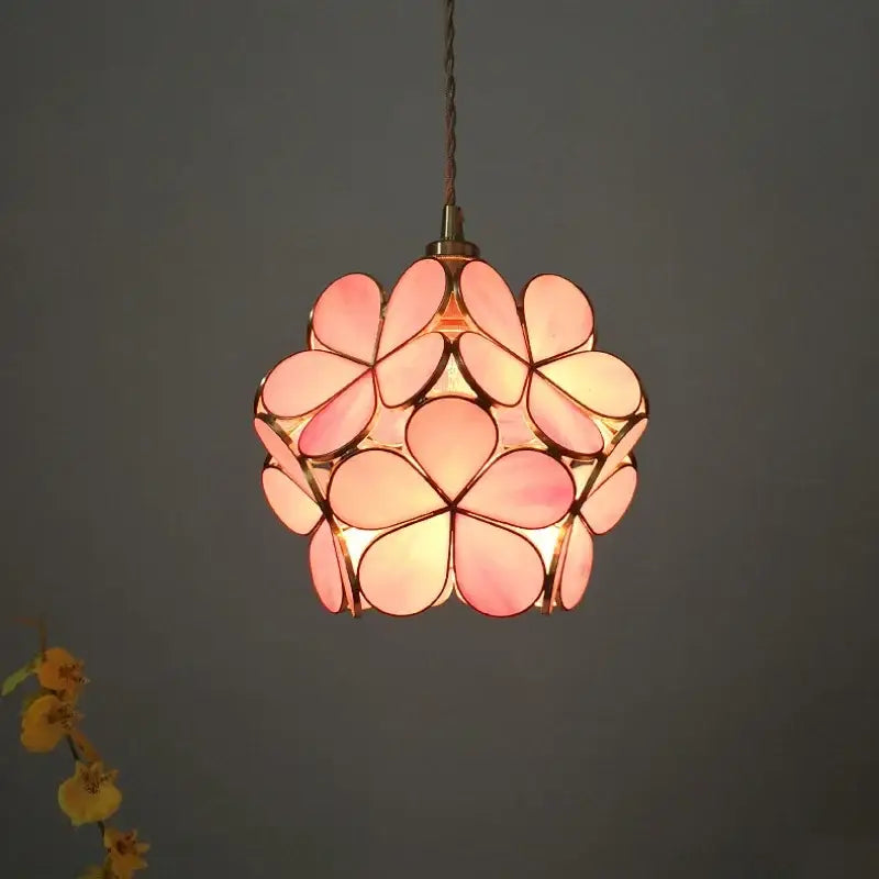 Modern pink floral pendant light with stained glass petals and brass frame featuring glass flower led design for dining room