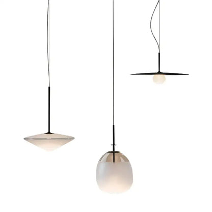 Modern glass flying saucer chandelier with three black metal stems and frosted glass shades in varying shapes