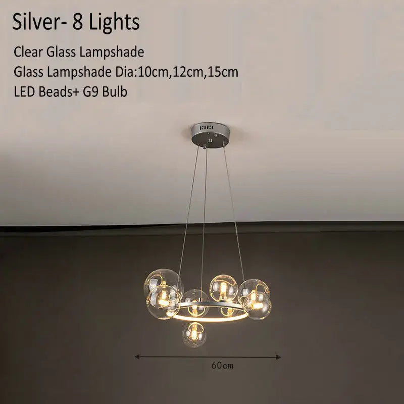 Silver modern glass chandelier lamp with eight clear glass lampshades suspended from a circular ceiling mount