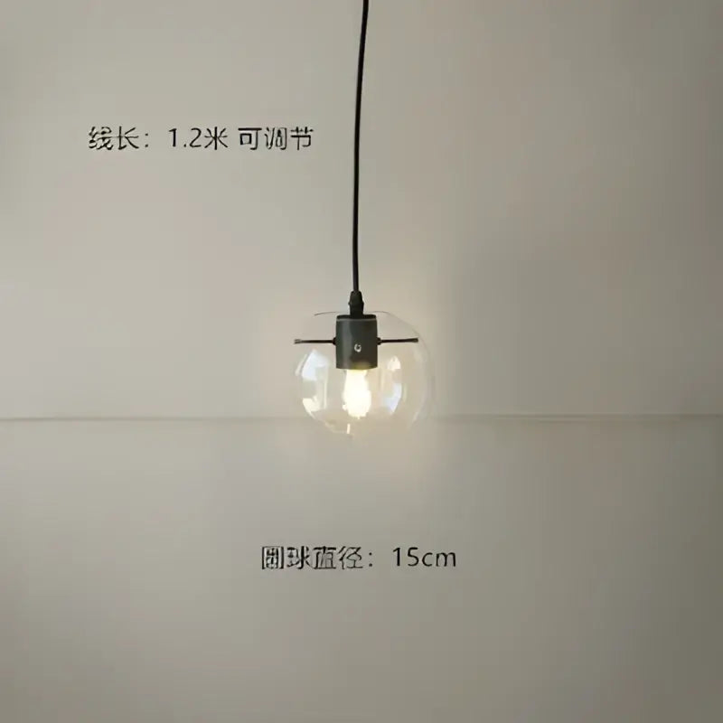Modern glass globe chrome pendant light with clear spherical glass globe and black metal fixture for dining room use