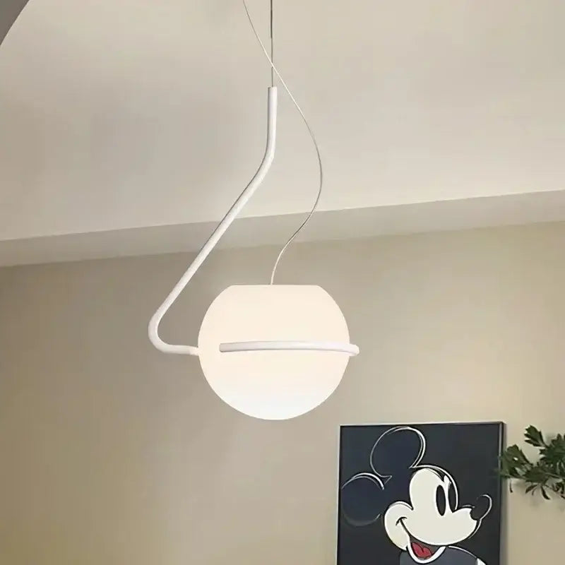 Modern glass globe pendant lamp with white spherical glass globe and minimalist curved metal arm for kitchen island decorbites pendant lamp