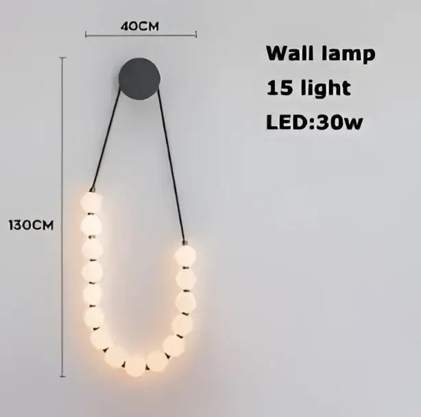 A modern black wall lamp with 15 warm white led lights in a curved design for decorbites glass gold pendant light decor