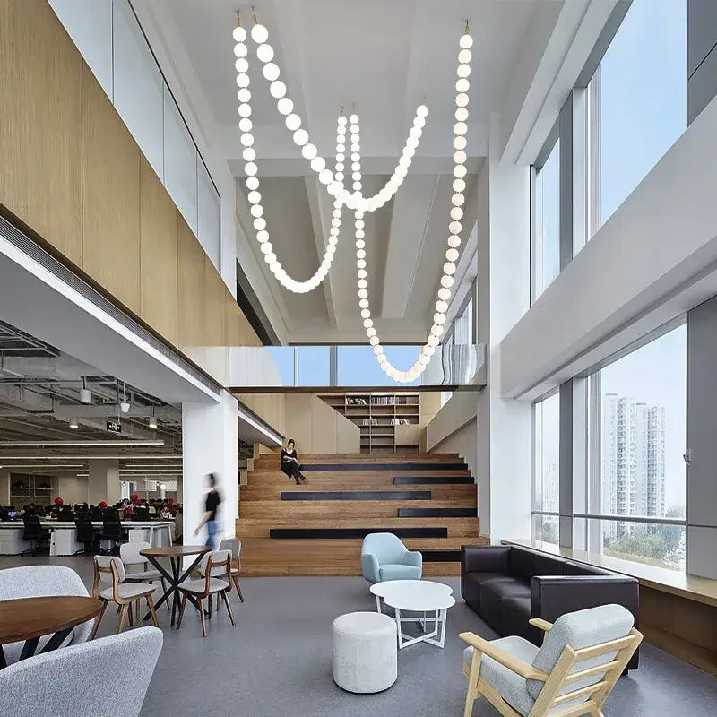 Modern glass gold pendant light featuring cascading spherical white bulbs for elegant living room decorbites glass gold pendant