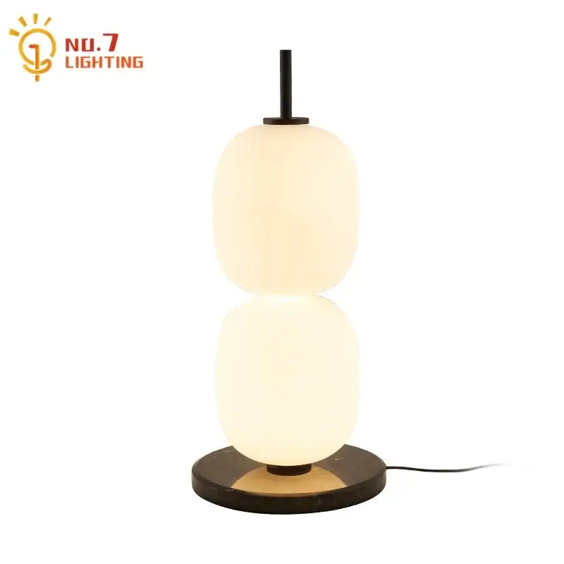 Modern glass gourd table lamp with two off-white glass orbs on a dark metal base for elegant bedroom decorbites table lamp