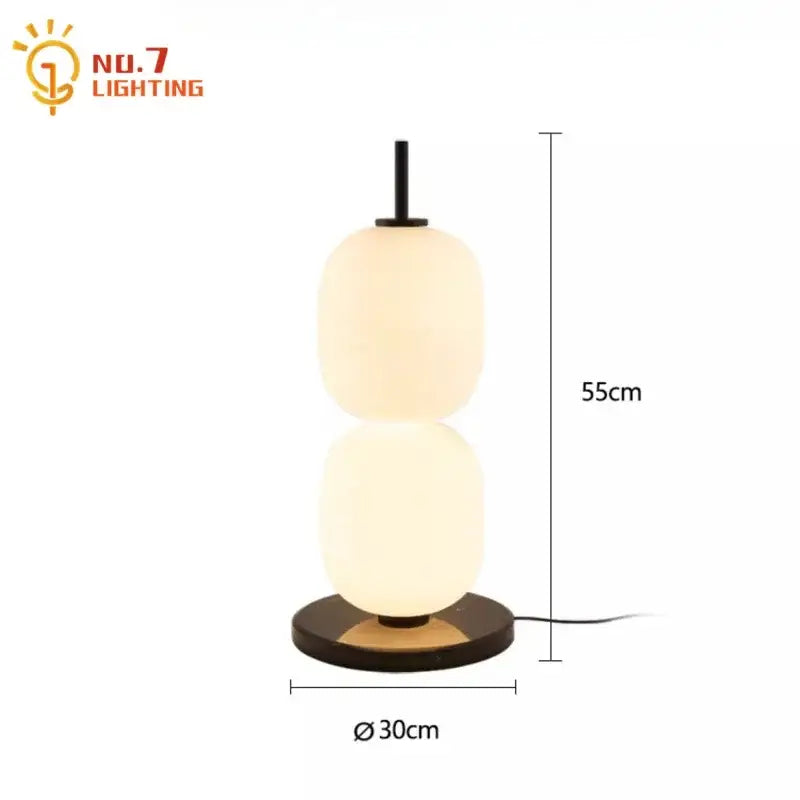 Modern glass gourd table lamp with two frosted glass orbs on a dark wood base decorbites glass gourd bedroom light