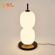 Modern glass gourd table lamp with two stacked oval glass shades black metal stem and marble base for bedroom decorbites glass gourd