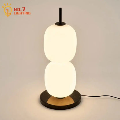 Modern glass gourd table lamp with two stacked oval glass shades black metal stem and marble base for bedroom decorbites glass gourd
